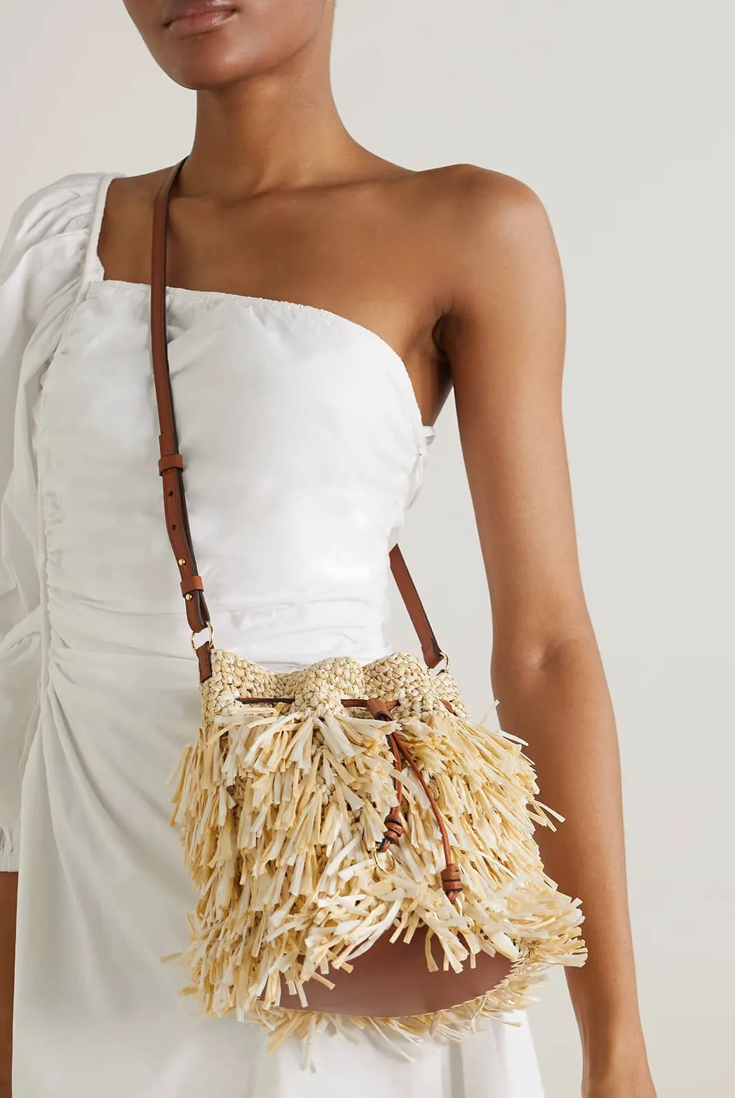 Gigi leather-trimmed fringed raffia bucket bag
